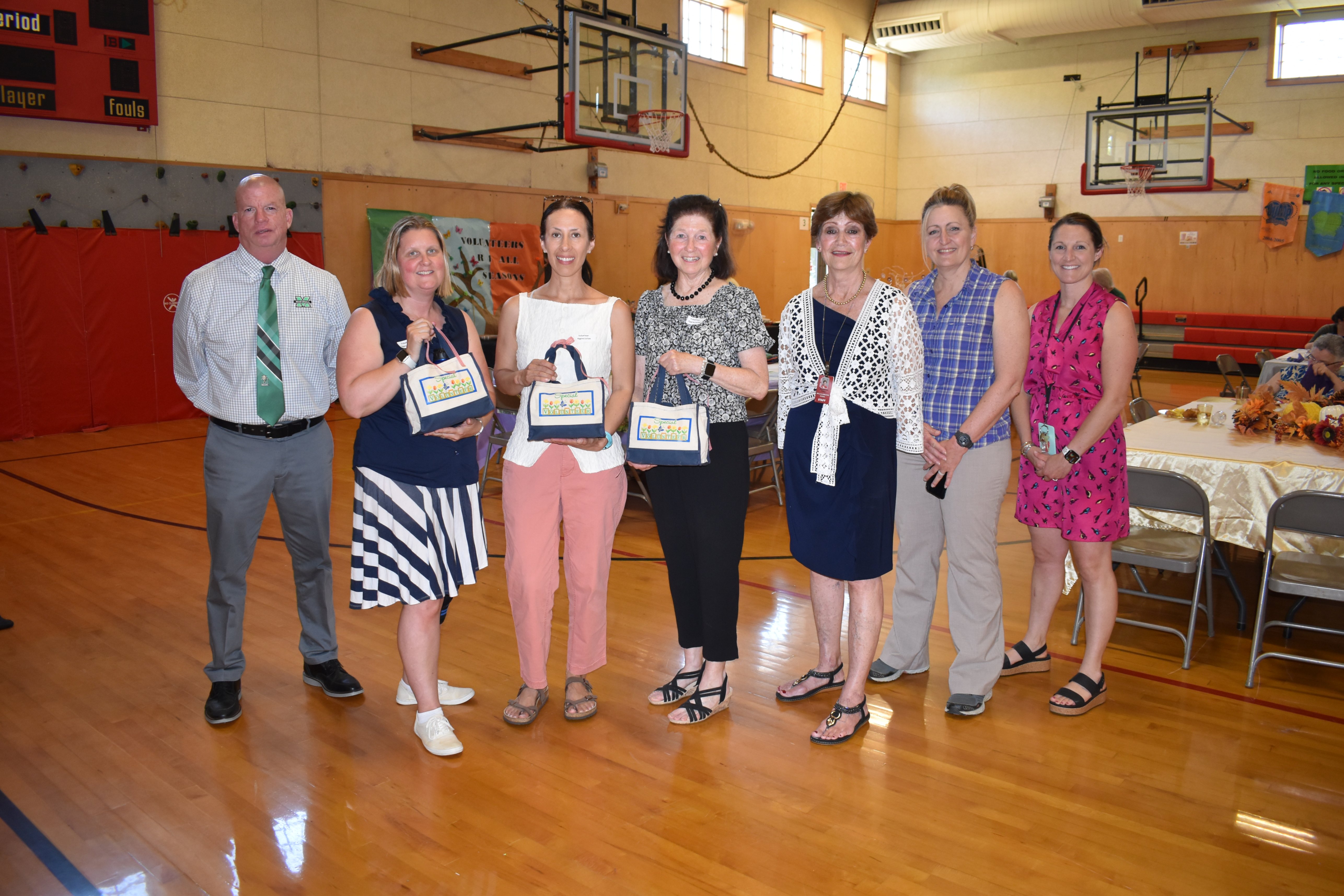 WOCSD Volunteers of the Year 2026:  From left to right are:  Superintendent James Daly, Allison Goodwin, Betsy Morales, Barbara Maurer, Maryanne Foley, Wells Elementary School Principal Theresa Curran and WES Assistant Principal and Dean of Students Jennifer Mayo.